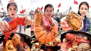 Chinese fishermen eat octopus, Boston lobster, scallops, clams, crabs, razor clams, conches