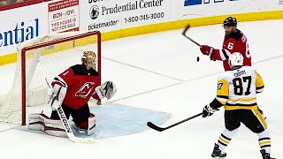 Crosby hits post, then swats puck out of air for OT winner