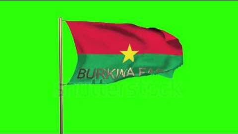 Burkina Faso flag with title waving in the wind. Looping sun rises style. Animation loop Stock