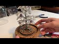 How to decorate a beaded wire white snow covered Christmas tree, and attach it to the base. DIY