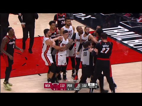Tyler Herro tries to fight Nurkic by shoving him and then Nurkic punches him in the head