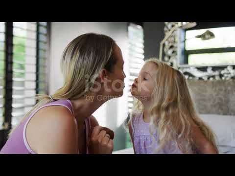 Cute Daughter Kisses Mommy | Stock Video