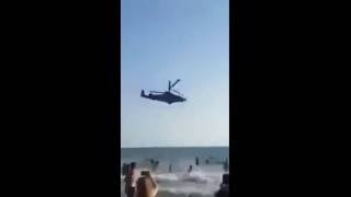 Syria: Air Show of a Ka-52 Attack Helicopter for bathing people on the beach