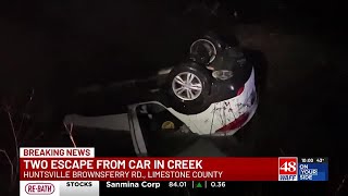 Two escape from car flipped in Limestone County creek