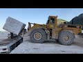 Caterpillar 988b wheel loader loading marble blocks on trucks  birros marble quarries