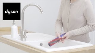 How to clean your Dyson Micro 1.5kg™ cordless vacuum's soft roller brush bar screenshot 2