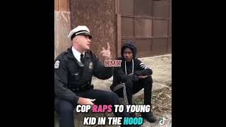 Cop raps to a young kid in the hood