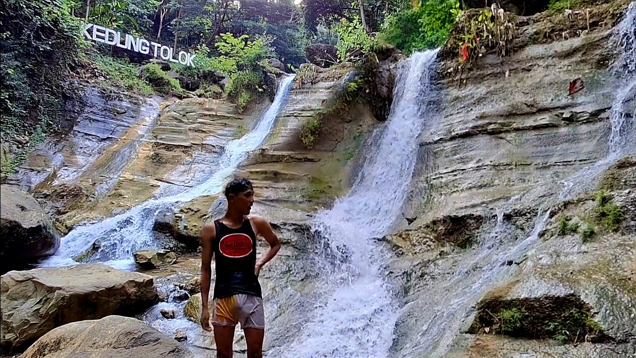 Enjoying the waterfall in the village