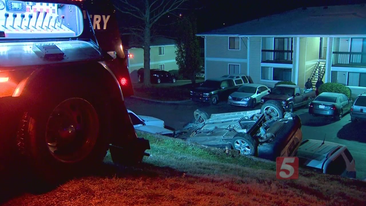Car Crashes Through Fence, Lands On Vehicles - YouTube