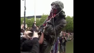 Au Royaume-Uni, des manifestants renversent la statue d'un marchand d'esclaves et la jettent à l'eau