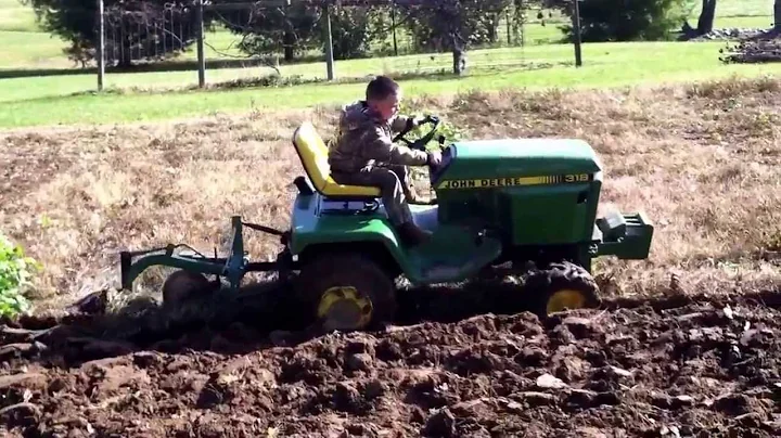 John Deere 318 plowing garden new generation
