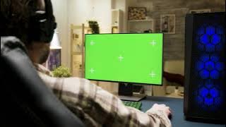 Man playing game on pc green screen video