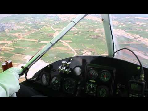 Microlight 'Lady Guinness' (9H-UMR) flying over Ma...