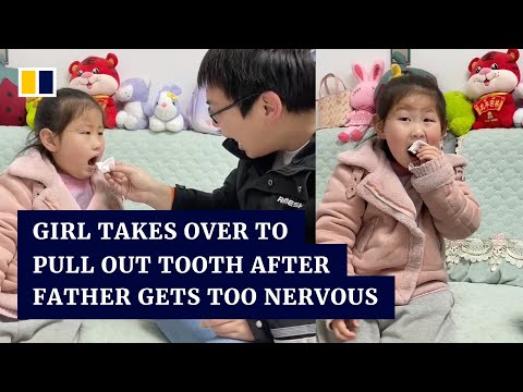 Chinese girl takes over to pull out her loose tooth after her father got too nervous to help