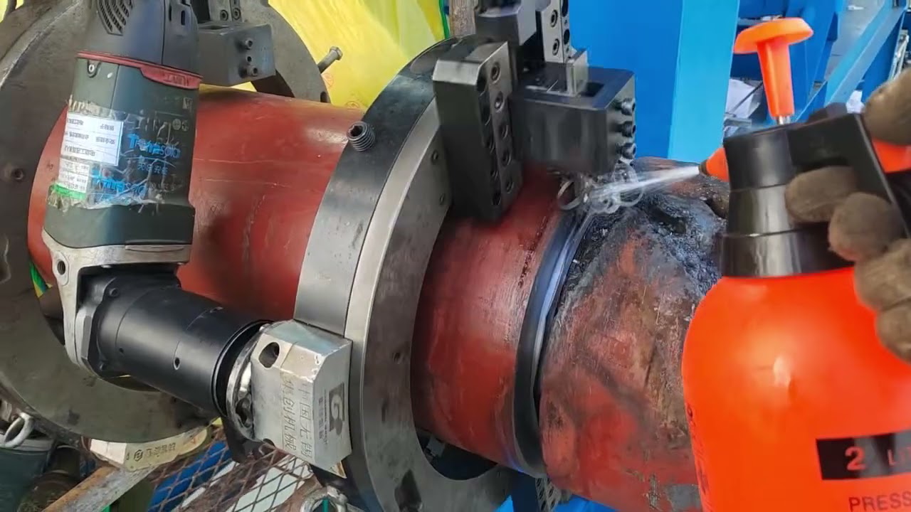 Pipe cutting and beveling machine