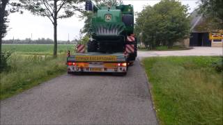 De Groen transport vervoerd de John deer t 550 combine