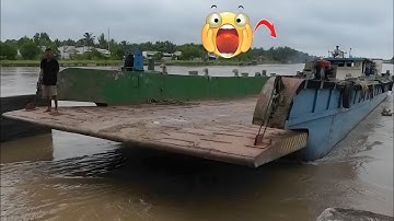 Dramatic close-up of boats crossing the dam gate.