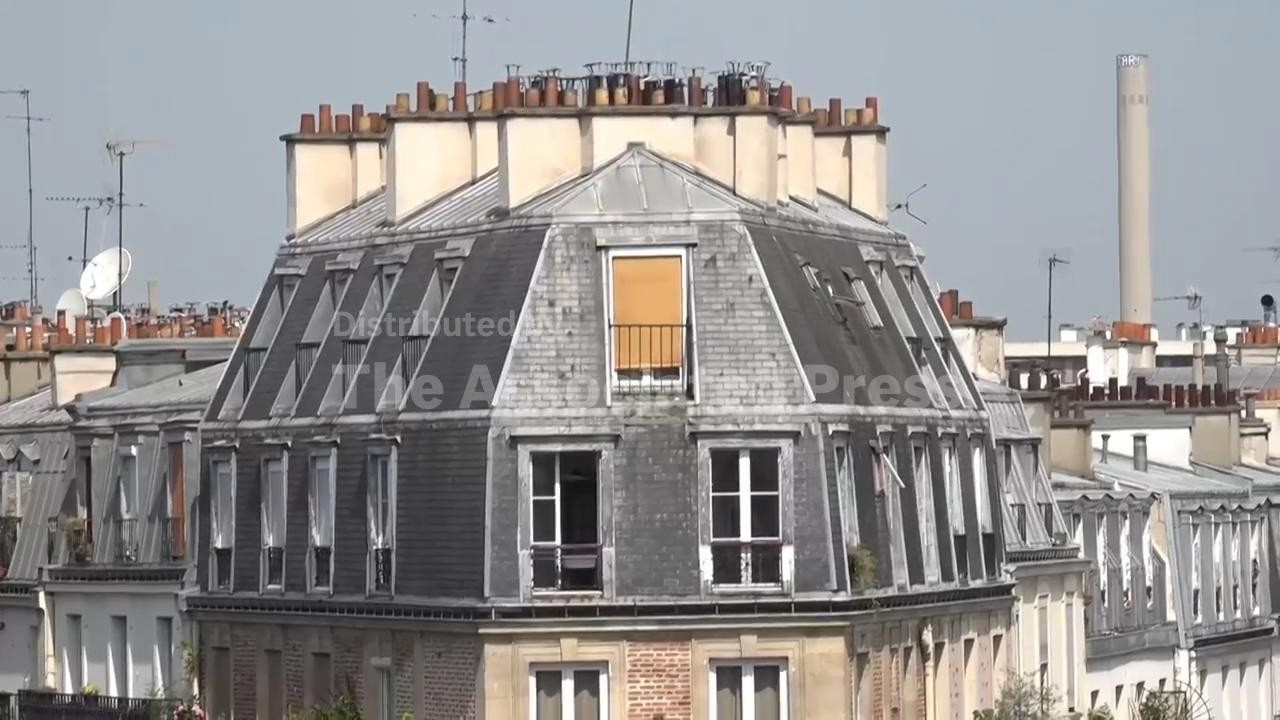 People living in attic apartments under zinc roofs of Paris suffer