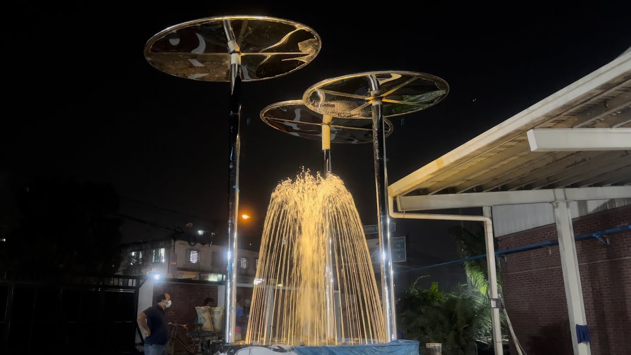 Spouting Water Fountain With Warm Colour Lighting Effect.
