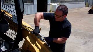 How to Release Auxiliary Hydraulic Pressure on a Cat 256C Skid Steer Loader