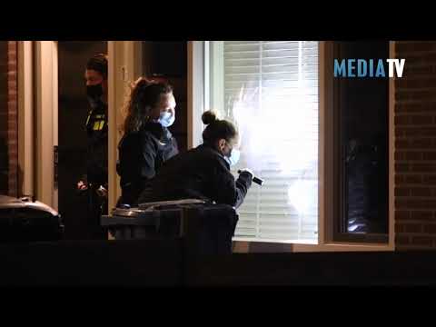 Woning beschoten: kogelgaten in de ramen en hulzen op straat