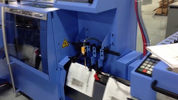 MBO Roll Fed SVC Sheeting System feeding Presto II Digital Stitcher making booklets at 600 fpm