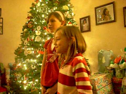 Kaitlyn and Emily singing Rudolph the red nosed ra...