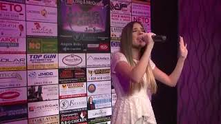 Julia Romaneli performing "Anyone" by Demi Lovato at The Singing Contest
