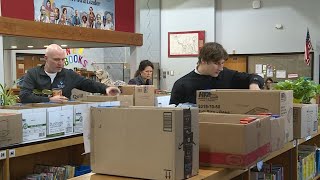 Topeka law firm lends helping hand to Lowman Hill’s annual Thanksgiving meal packs