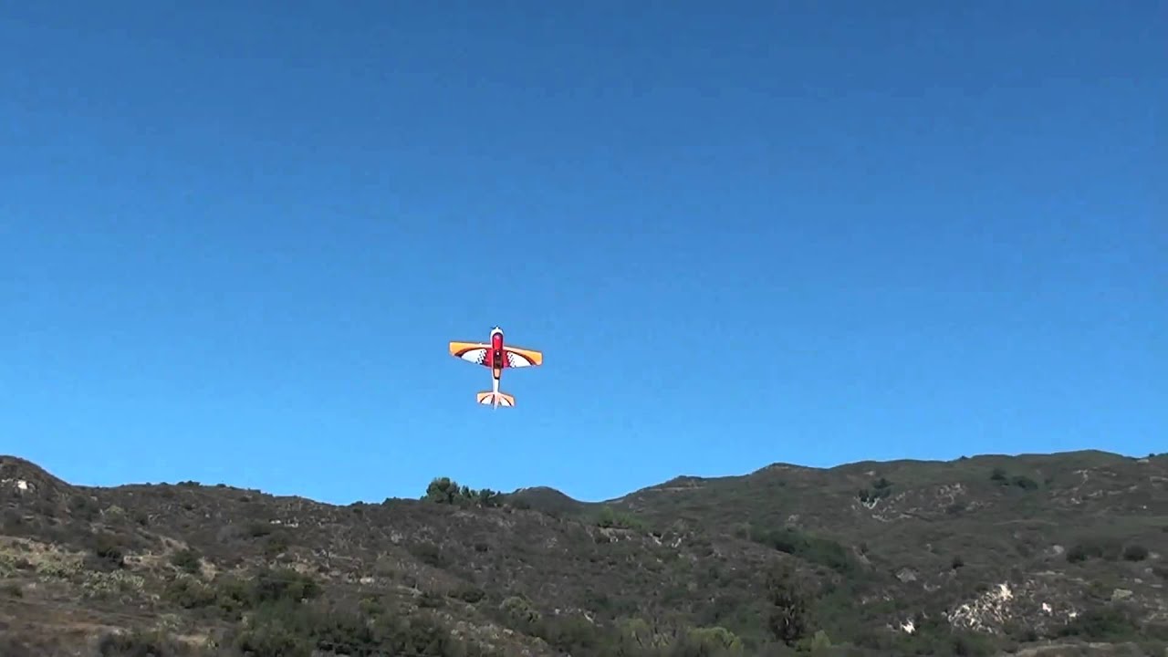 Going under the electric wires with his Yak54 from a hover
