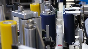 Onitex L200 labeler. Application of Wrap-Around on Cylindrical Containers