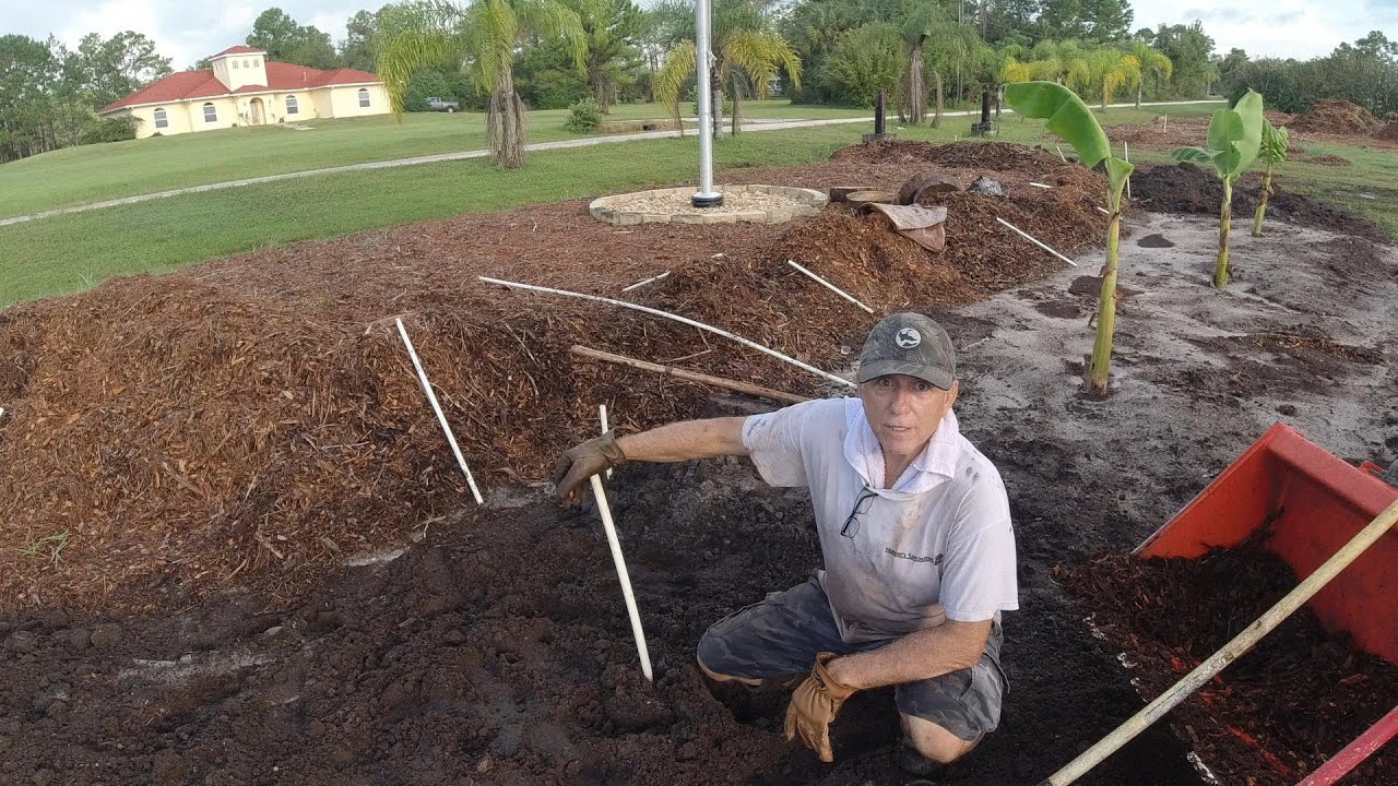 P6 Hugelkultur Banana plants digging beds Adding Logs and wood chips
