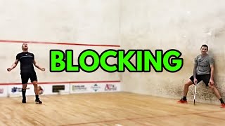 SQUASH. Premature celebration brought back for blatant blocking