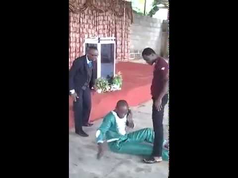 African Guy Answers His Phone During Pastor's Anointment! I'm Under Serious I Will Call REBLOP.com