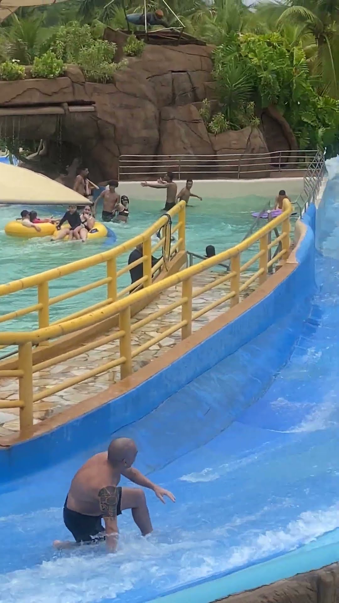 Unexpected Tumble Sends Family Down the Water Slide Together