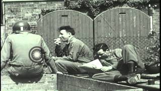 Soldiers of 71st Infantry Regiment relax in boxcars, read, play cards and musical...HD Stock Footage