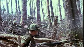 United States soldiers talk on radio, help wounded soldier and carry a man on lit...HD Stock Footage
