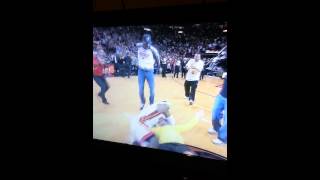 Lebron tackles this fan for incredible shot