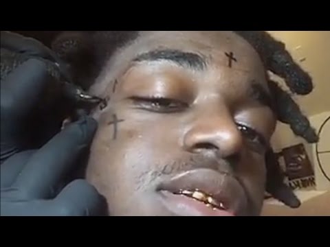 Kodak Black Tattoos Three Crosses On His Face Youtube