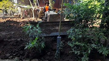Bulldozer pushing the soil into pit ! complete ! mitsubishi bd2f and dump truck 5 ton working