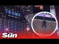 'BLM supporter' dangles from Chicago Trump Tower demanding to speak to the President
