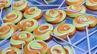 Hand Making Lollipops from Melted Sugar. Seen in Prague, Czech republic