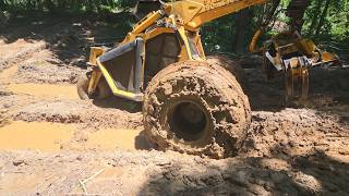 Logging Through the mud: Bell Harvester Operations and Skidder dragging wood.
