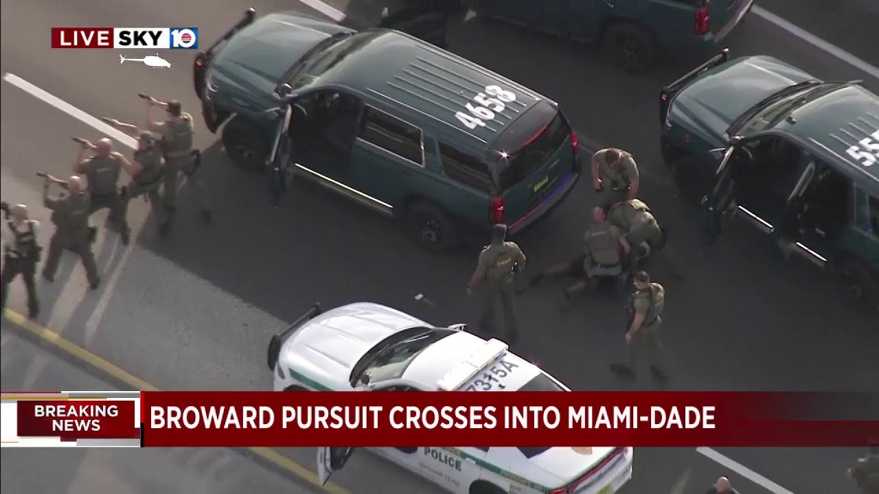 Suspect walks backwards towards police after high-speed chase - YouTube