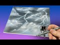 Airbrushing stormy clouds with lightning