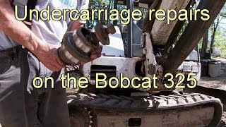 Undercarriage repairs to my Bobcat 325. Roller replacement and dirt shield repairs.