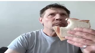 'julie - feminine adornments' but its just the dude chilling and enjoying a sandwich