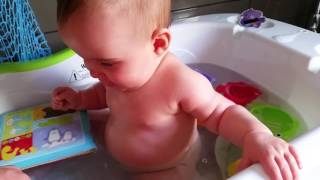 Baby laughing bath time fun with Charlotte