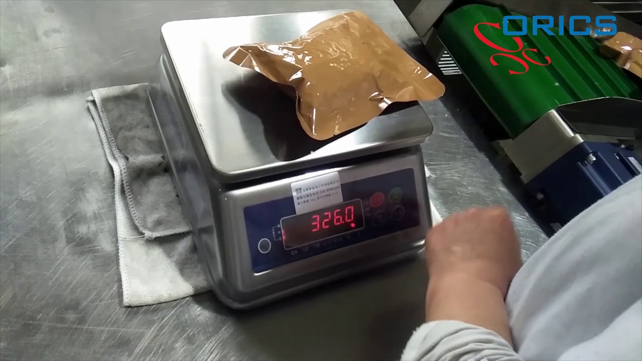 Filler weigher and vacuum bagger for sticky food products