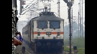Secunderabad Rajdhani Express sprints towards its desitnation, LP acknowledges cameras presence
Location: Asaoti, Faridabad, Haryana
11th September 2014, 1032 Hrs
Train: 12437 Secunderabad - Hazrat Nizamuddin Rajdhani Express
Loco: Lalaguda(LGD) WAP-7#30298
About half an hour late running 12437 Secunderabad - Hazrat Nizamuddin Rajdhani Express crosses my 54004 Nizamuddin Kosi Kalan Passenger just outside of Ballabhgarh with LGD WAP-7#30298 at its helm.
Locopilot of the WAP-7 acknowledges the presence of camera and turns on the headlamps. Secunderabad Rajdhani Express sprints towards its desitnation, LP acknowledges cameras presence
